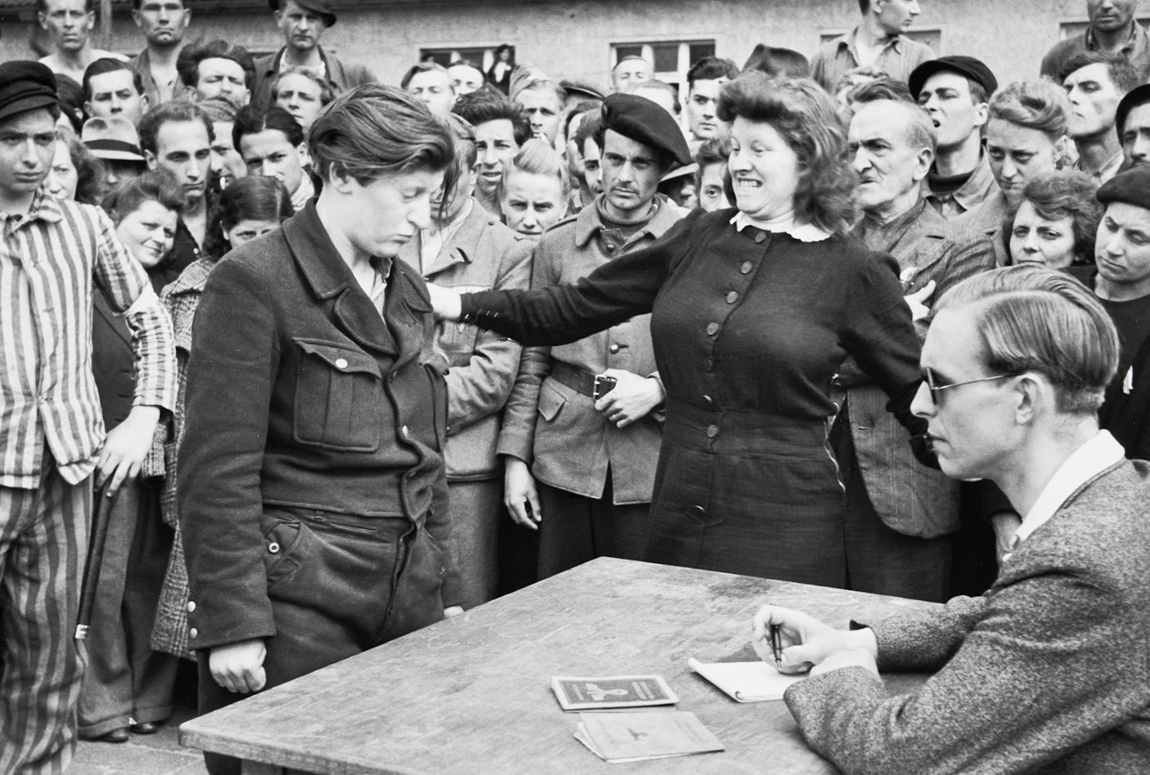 Gestapo informer recognized by a woman she had denounced, Transit Camp, Dessau by Henri Cartier-Bresson
