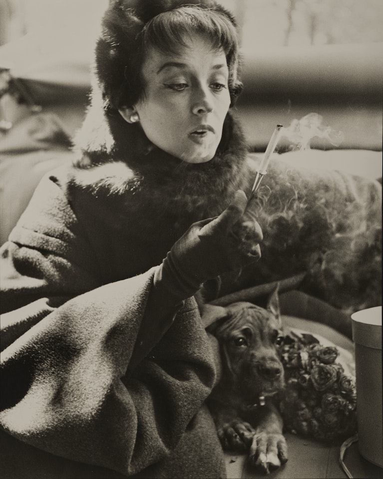 Dorian Leigh, coat by Dior, avenue Montaigne, Paris, August 1949 by Richard Avedon