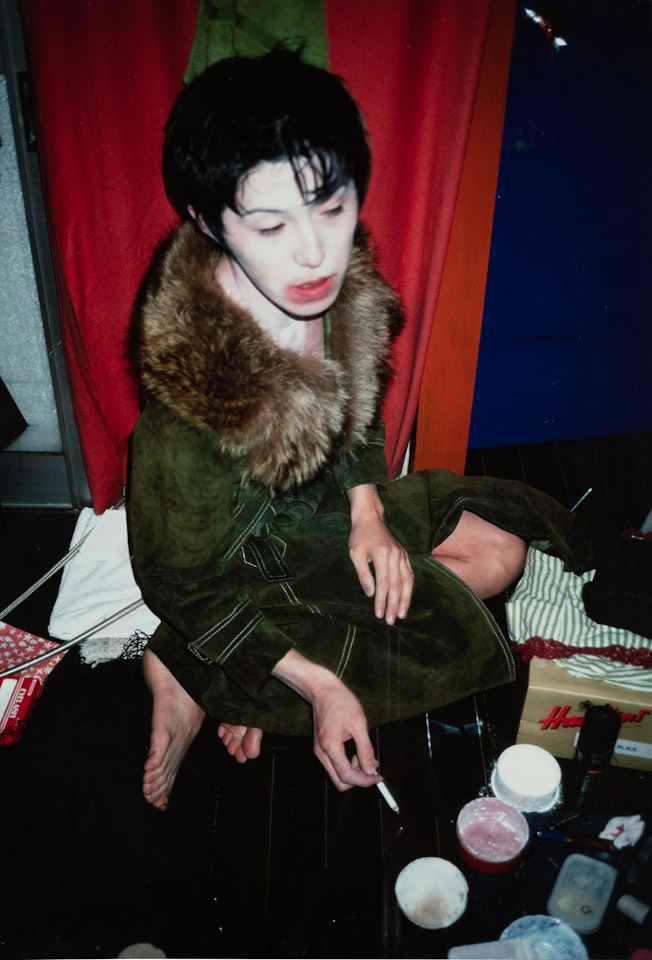 Takaho putting on make up, Tokyo by Nan Goldin