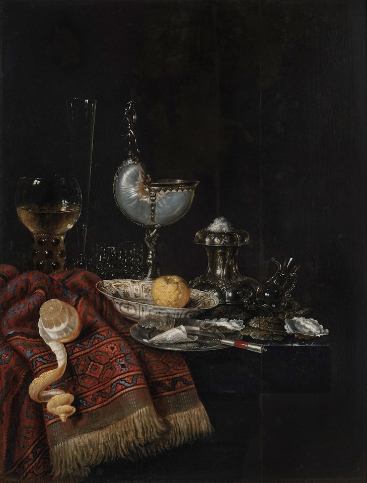Still life with a nautilus cup, roemer, silver salt cellar, porcelain bowl, lemons, and oysters on a stone ledge, partly draped with a Persian rug by Willem Claesz Heda