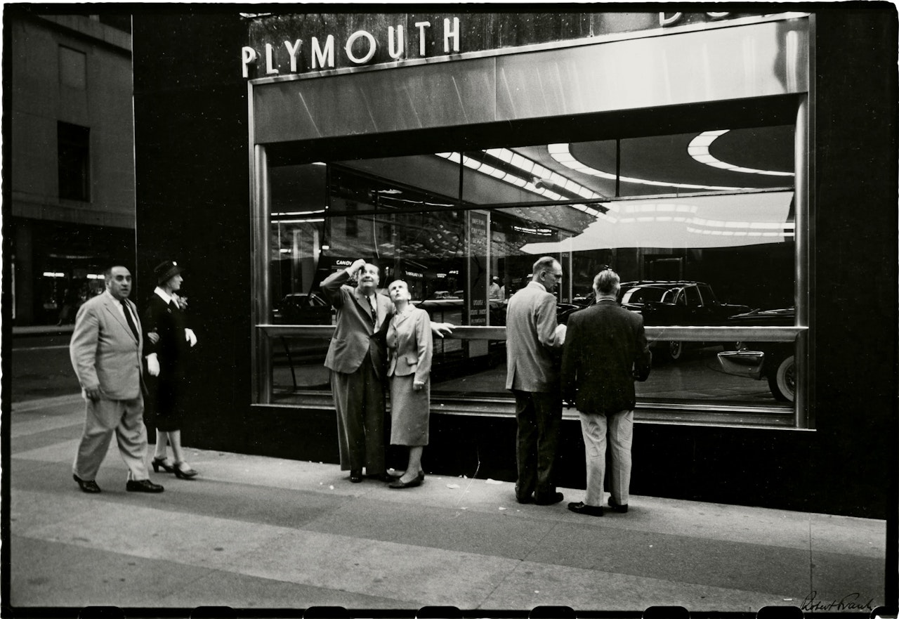 From the Bus (Plymouth Dealership) by Robert Frank