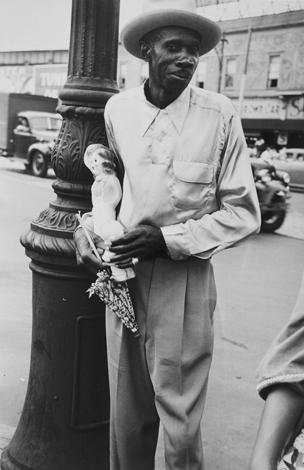 "Coney Island" (Man With Party Favors) by Robert Frank