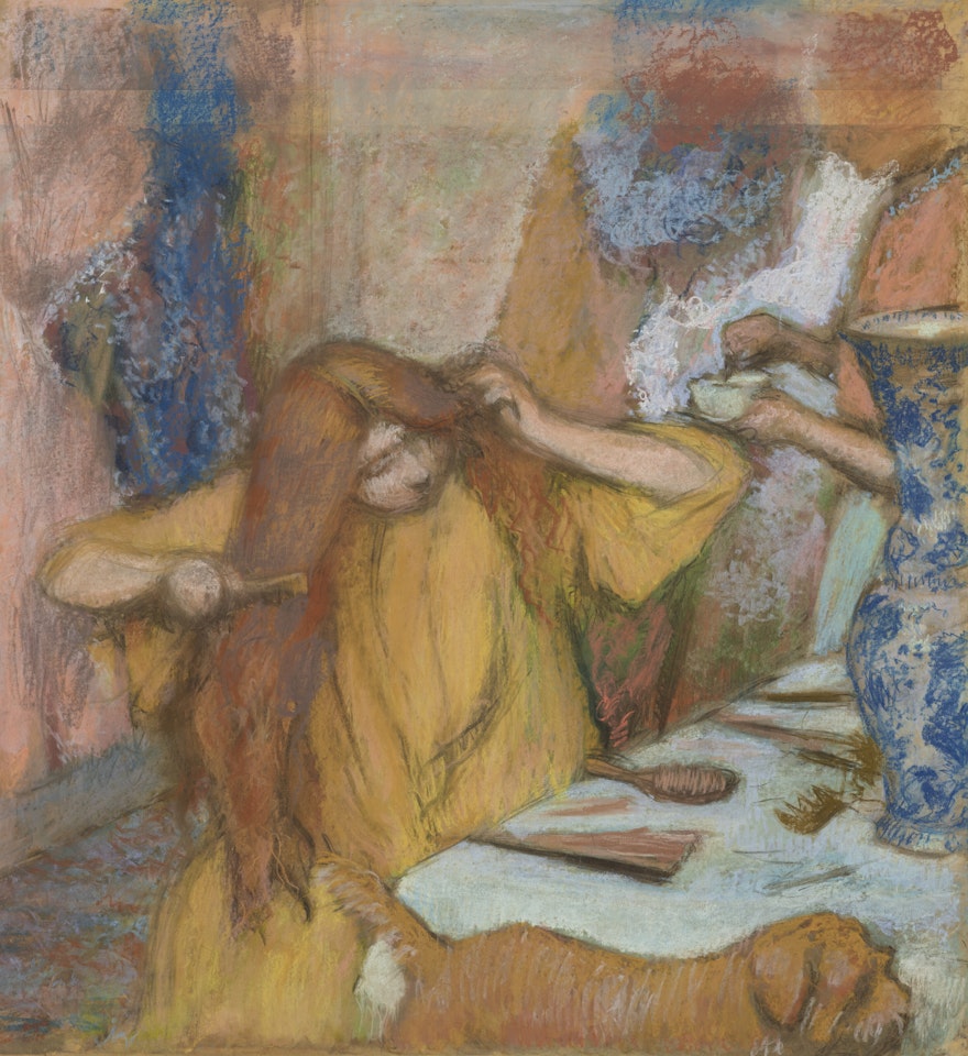 Femme en peignoir jaune se coiffant by Edgar Degas