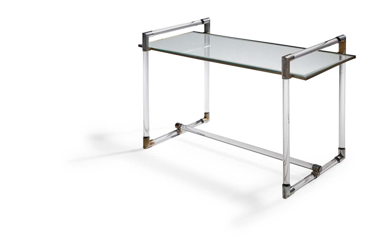 Occasional Table circa  chrome-plated metal, glass  height 21 in (53.5cm); width 31 1/2in (80cm); depth 15 5/8in (39.7cm) by Jacques Adnet
