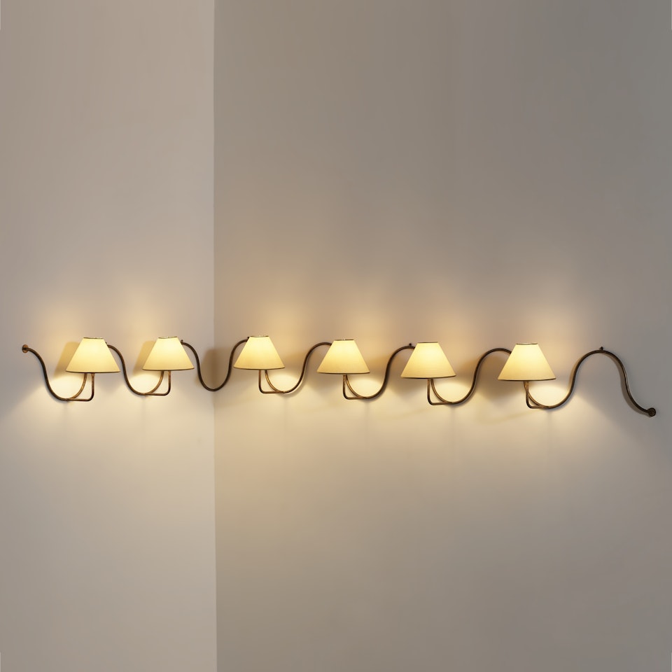 IMPORTANT 'ONDULATION' CORNER WALL LIGHT, CIRCA 1952 by Jean Royere