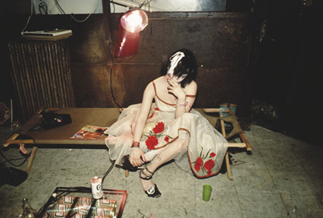 Trixie on the cot, NYC, 1979 by Nan Goldin