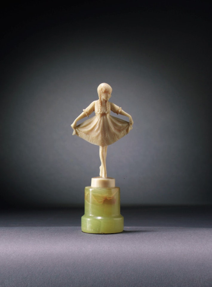Young girl holding her skirt by Ferdinand Preiss