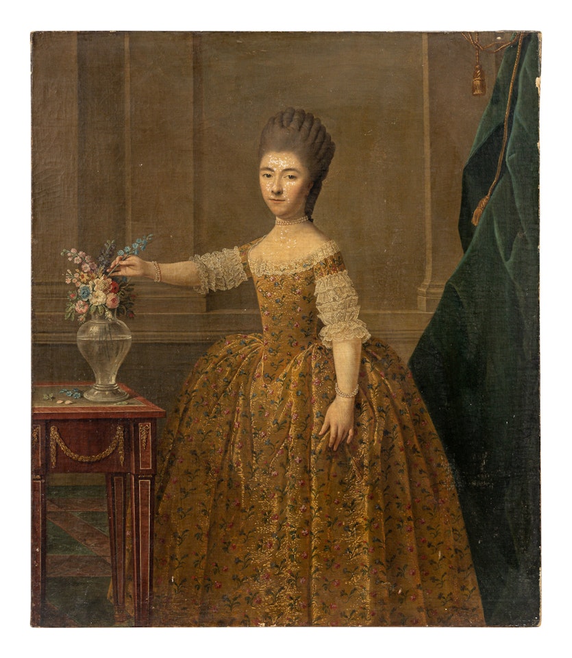 A Lady Arranging Flowers by German School