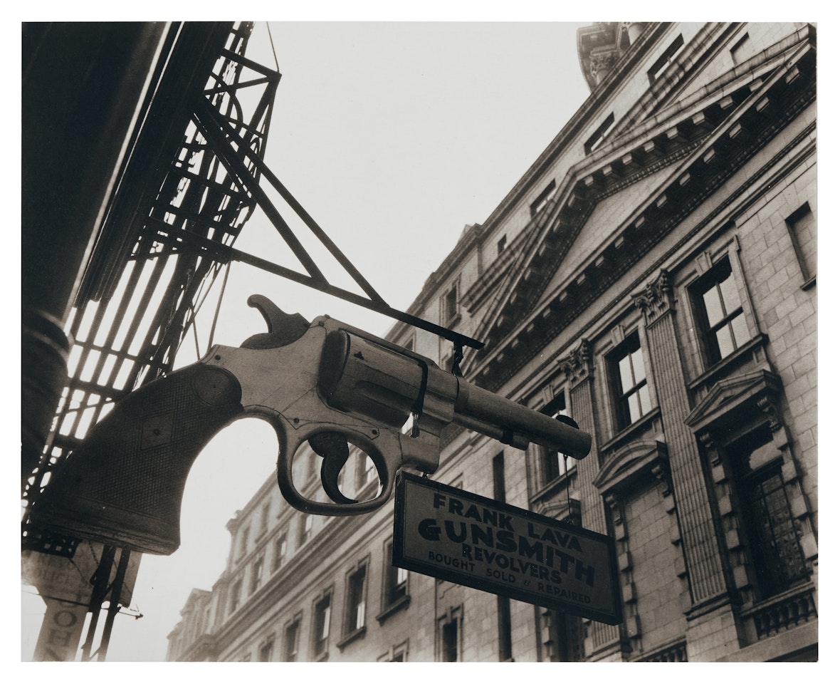 "Gunsmith opposite Police Department, Centre Street, New York City" by Berenice Abbott