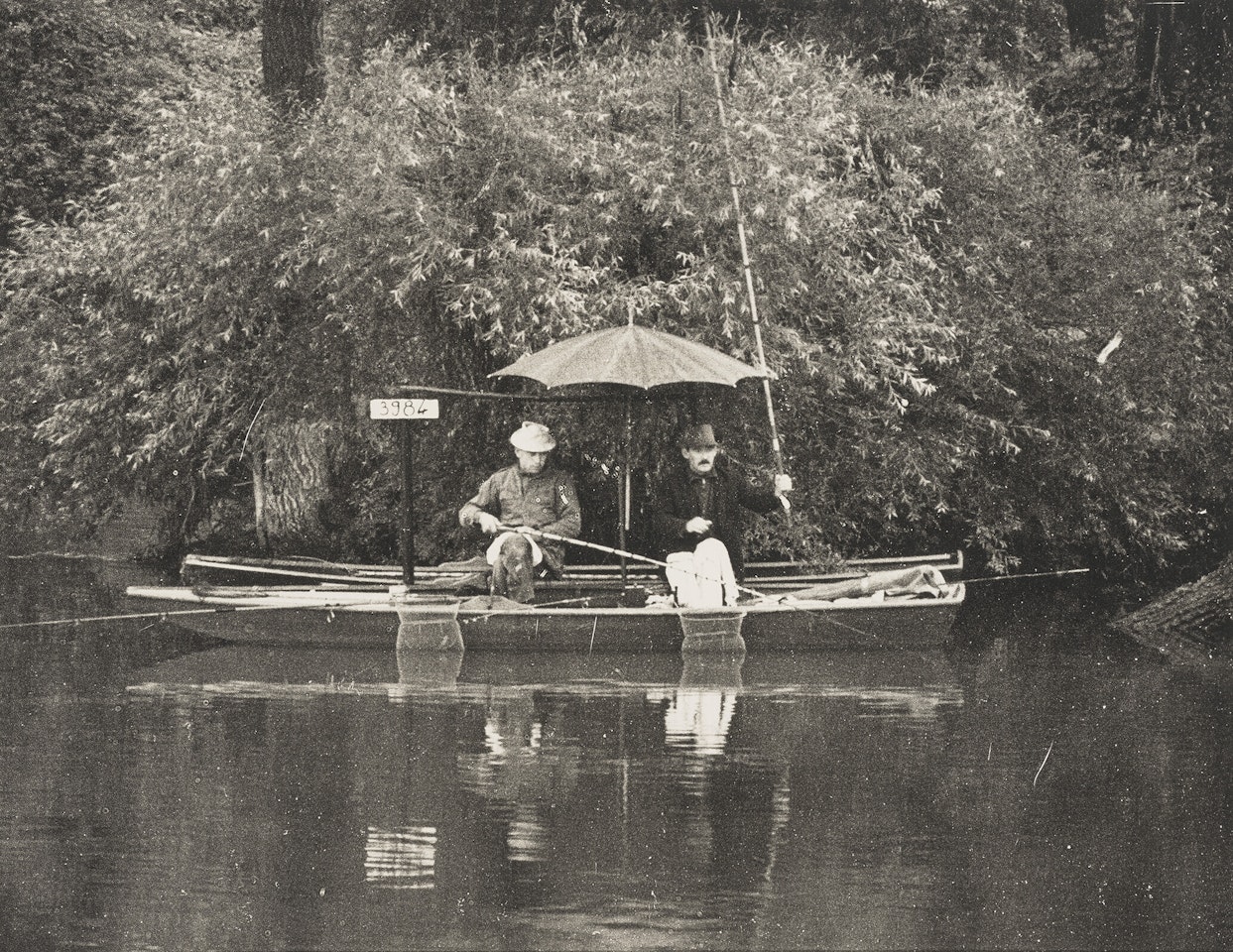 Two men fishing from a boat (The Marne) by Irving Penn