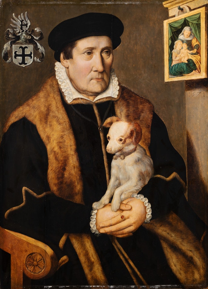 Portrait of a man holding a dog in his hands by Dutch School