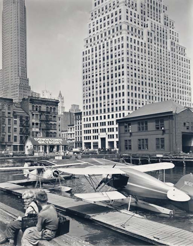 Downtown Skyport, Foot of Wall Street, from the  Retrospective  portfolio by Berenice Abbott
