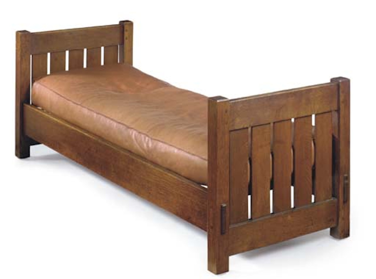 An Oak And Leather Settle by Gustav Stickley