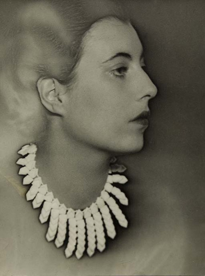 Model wearing necklace by Elsa Triolet by Man Ray