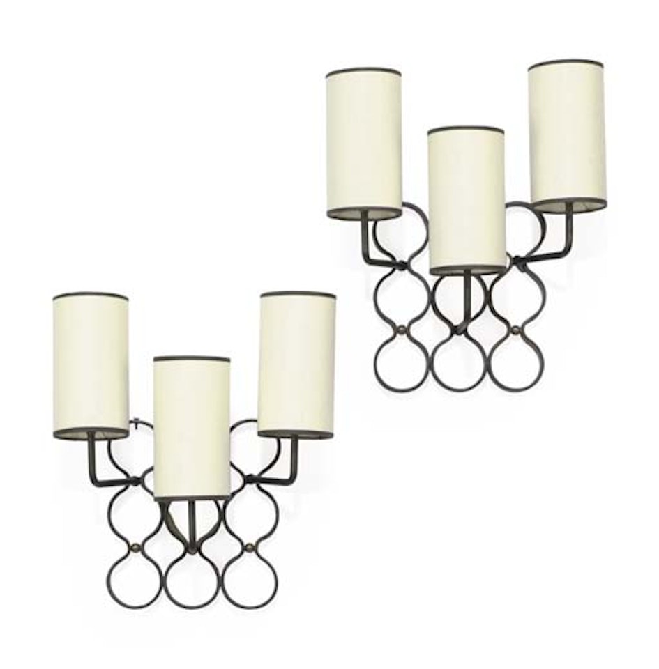 A Pair Of Painted Metal And Brass Sconces by Jean Royere