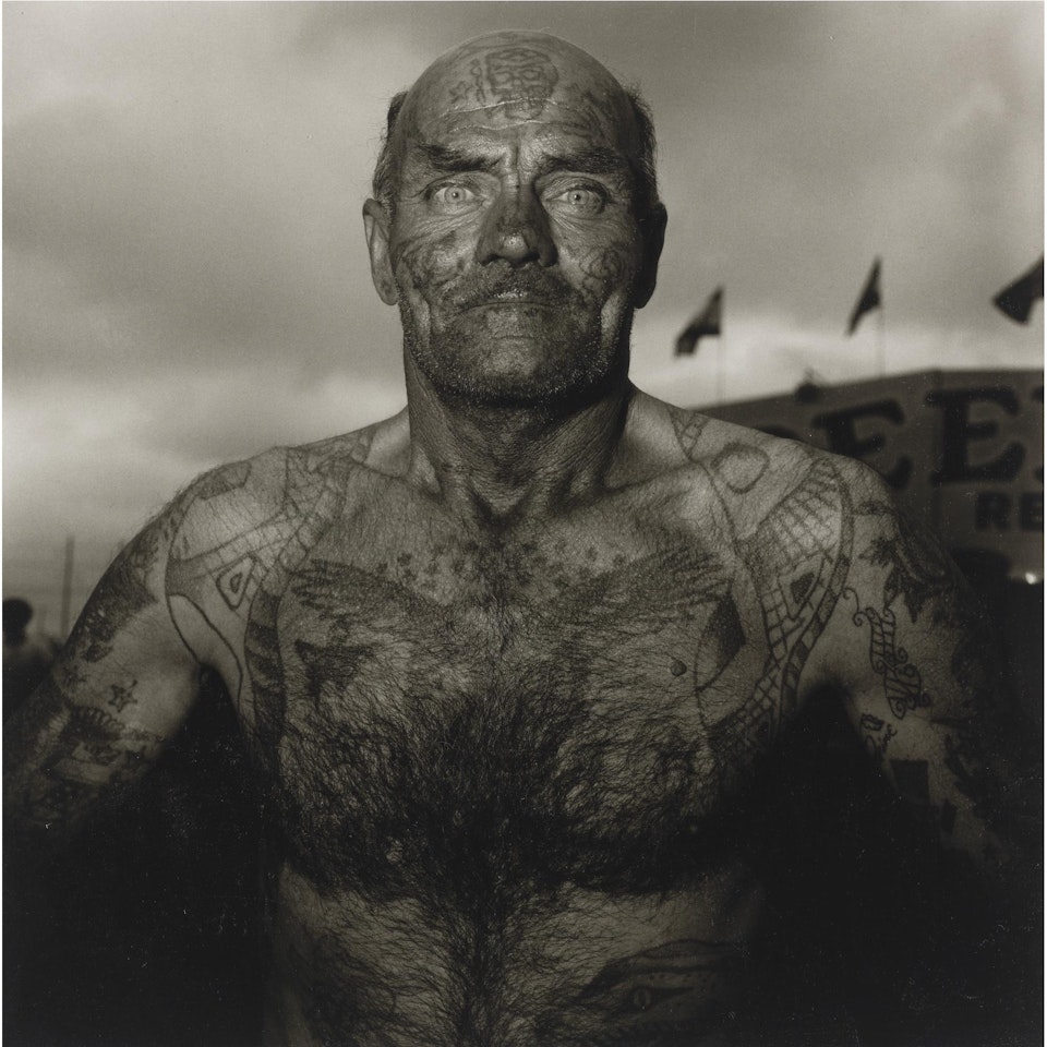 Tattooed Man At A Carnival, MD. by Diane Arbus by Neil Selkirk