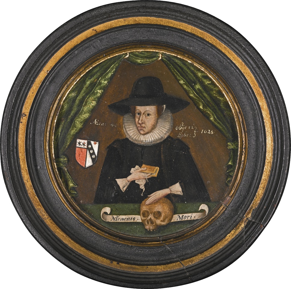 PORTRAIT OF HUGH PRUST (D. 1628) OF GORVEN, DEVON, HALF-LENGTH, HOLDING A BOOK AND RESTING HIS HAND ON A SKULL by English School