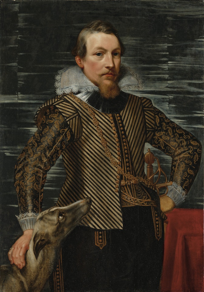 Portrait of a gentleman, three-quarter length, in a striped jacket, standing by a table, with a greyhound by Peter Paul Rubens