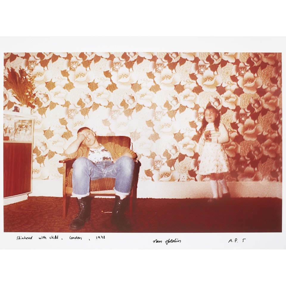 SKINHEAD WITH CHILD, LONDON by Nan Goldin