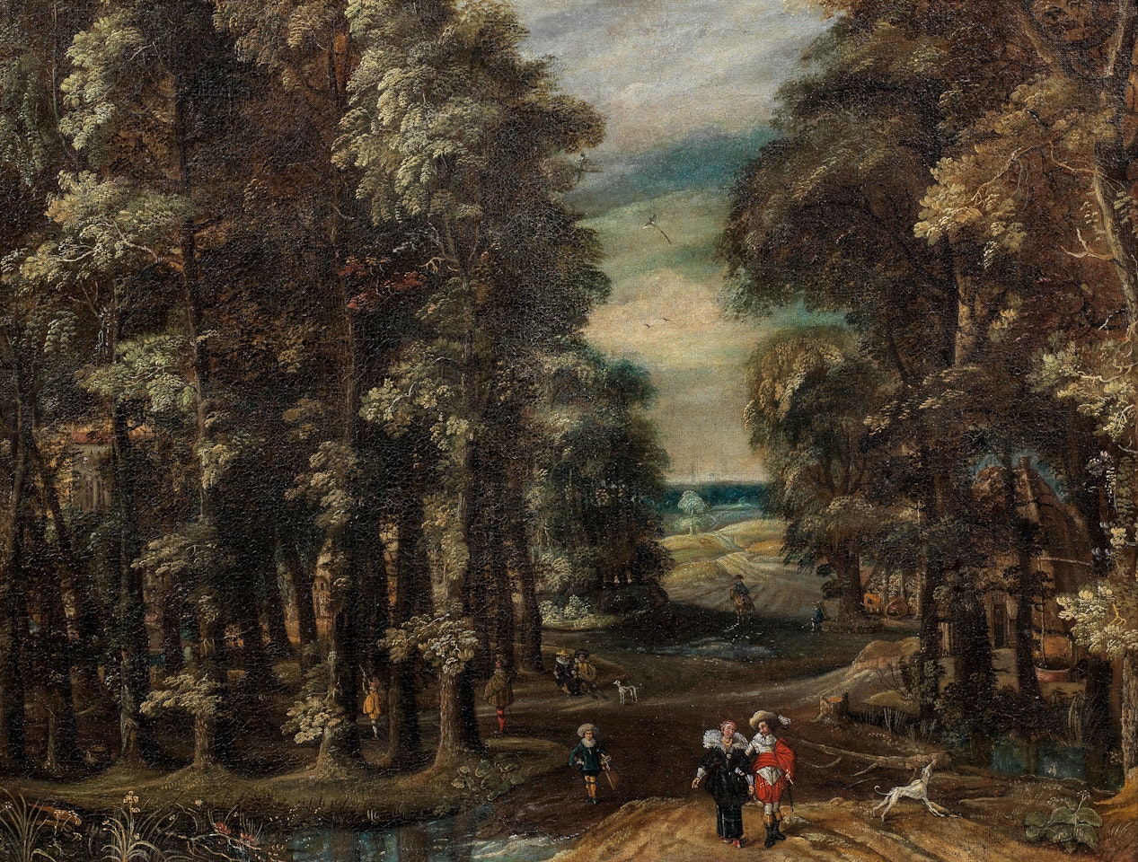 Elegant figures in a wooded landscape by Adriaen van Stalbemt