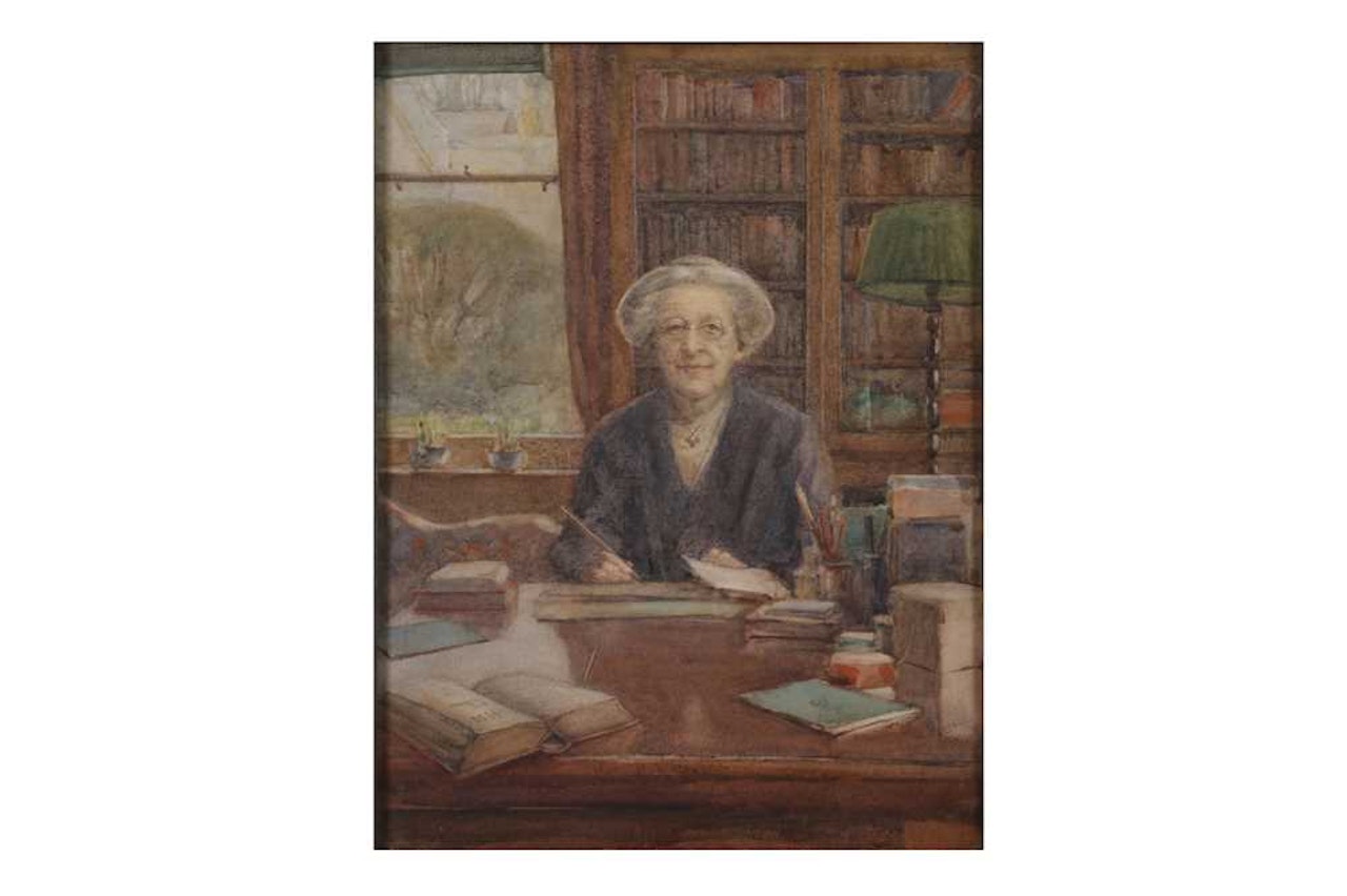 Portrait of a lady seated at her writing desk holding a dip pen, in a study lined with bookshelves by English School