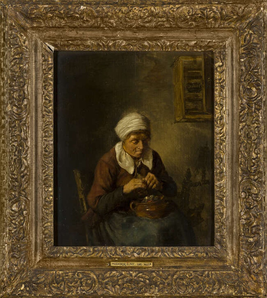 An old woman warming her hands over a pot of coals by Dutch School