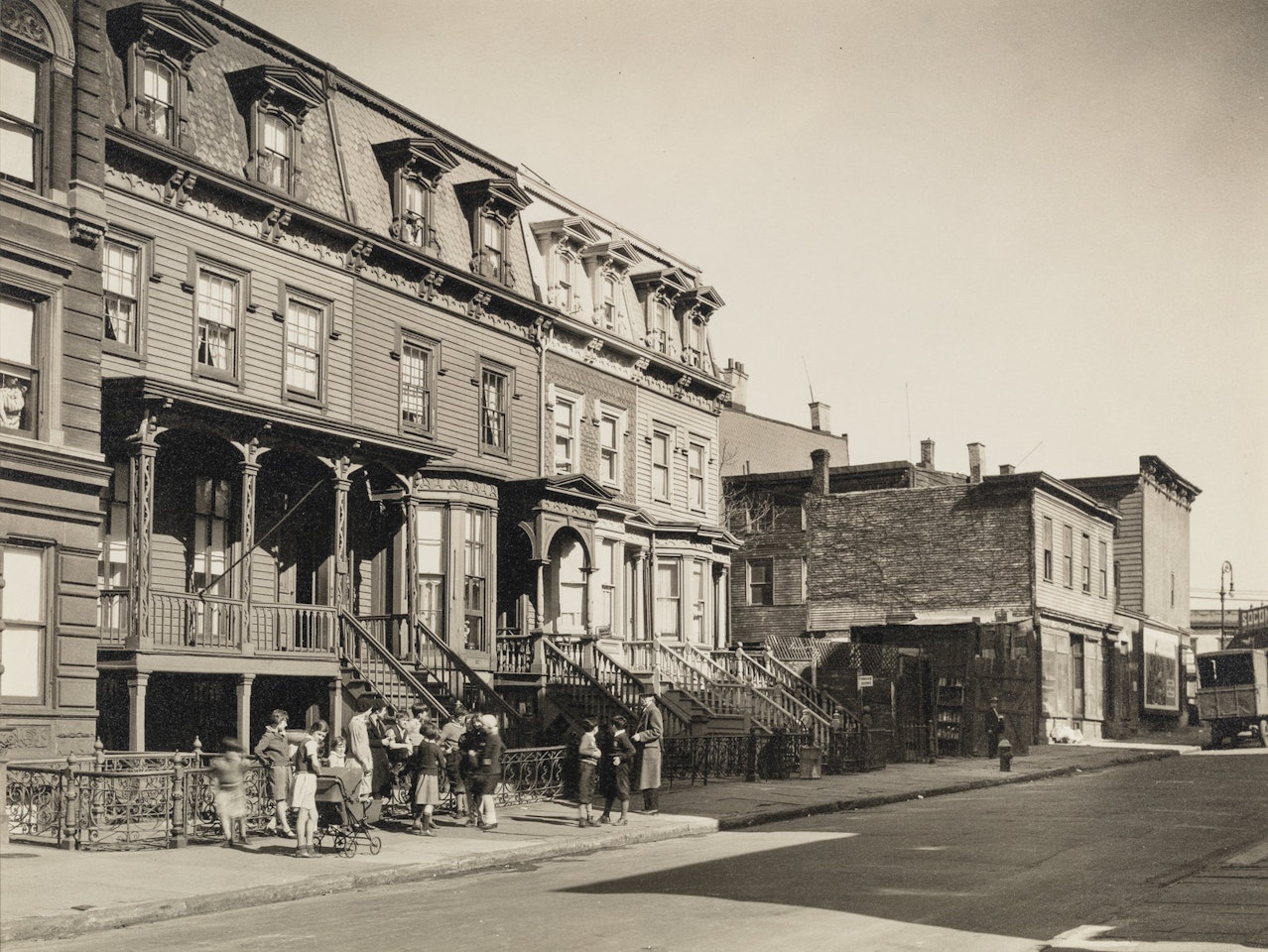 Untitled, New York (Children and brownstones), c. 1935 by Berenice Abbott