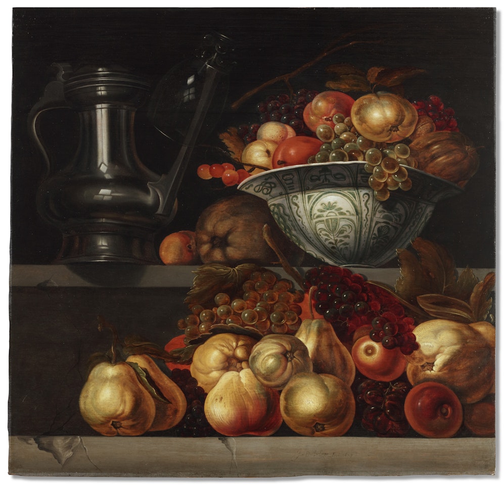 A pewter flagon with a small roemer hanging from its spout and a Chinese Wan-li dish with fruit on a high stone ledge, a heap of pears, apples, plums, grapes and citrus fruit on a parallel low stone ledge by Jan Davidsz de Heem