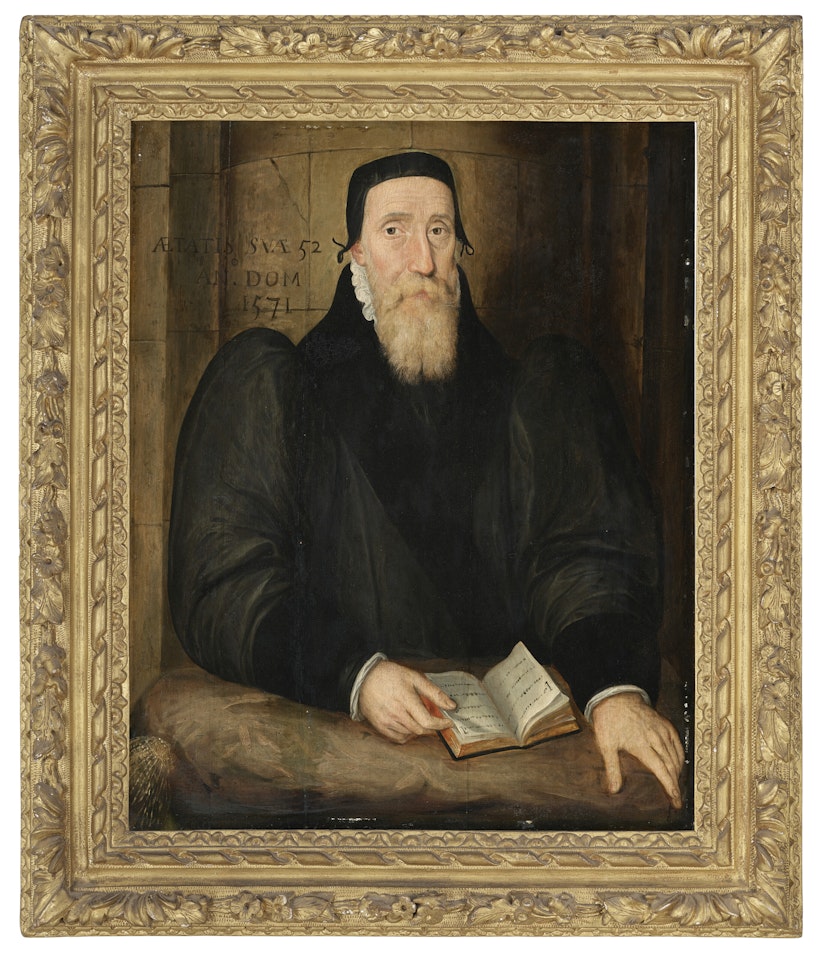 Portrait of Edwin Sandys, Bishop of London and later Archbishop of York (1519-1588), half-length, in a black fur-trimmed gown and hat, holding a page in a book by English School
