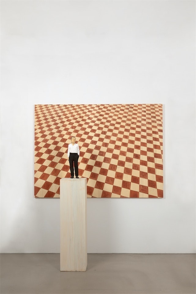 Man with black trousers with rhomb relief by Stephan Balkenhol