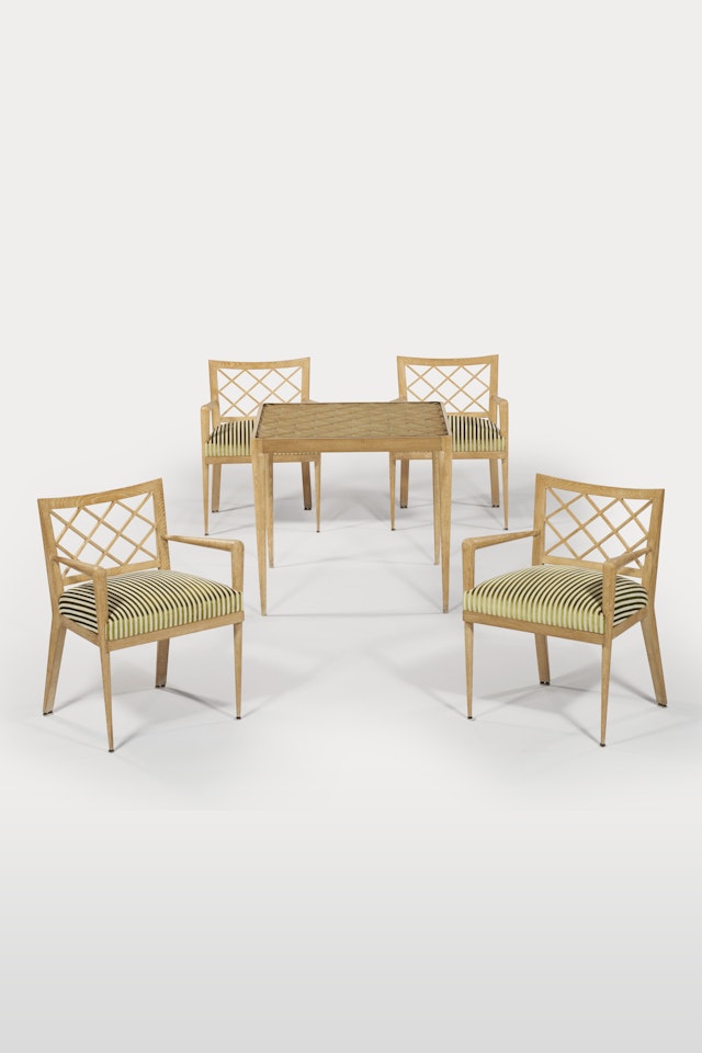 'CROISILLON' GAMES TABLE WITH FOUR 'CROISILLON' ARMCHAIRS, CIRCA by Jean Royere