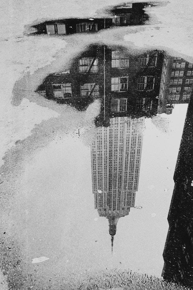 Puddle' (Empire State Building, New York) by André Kertész