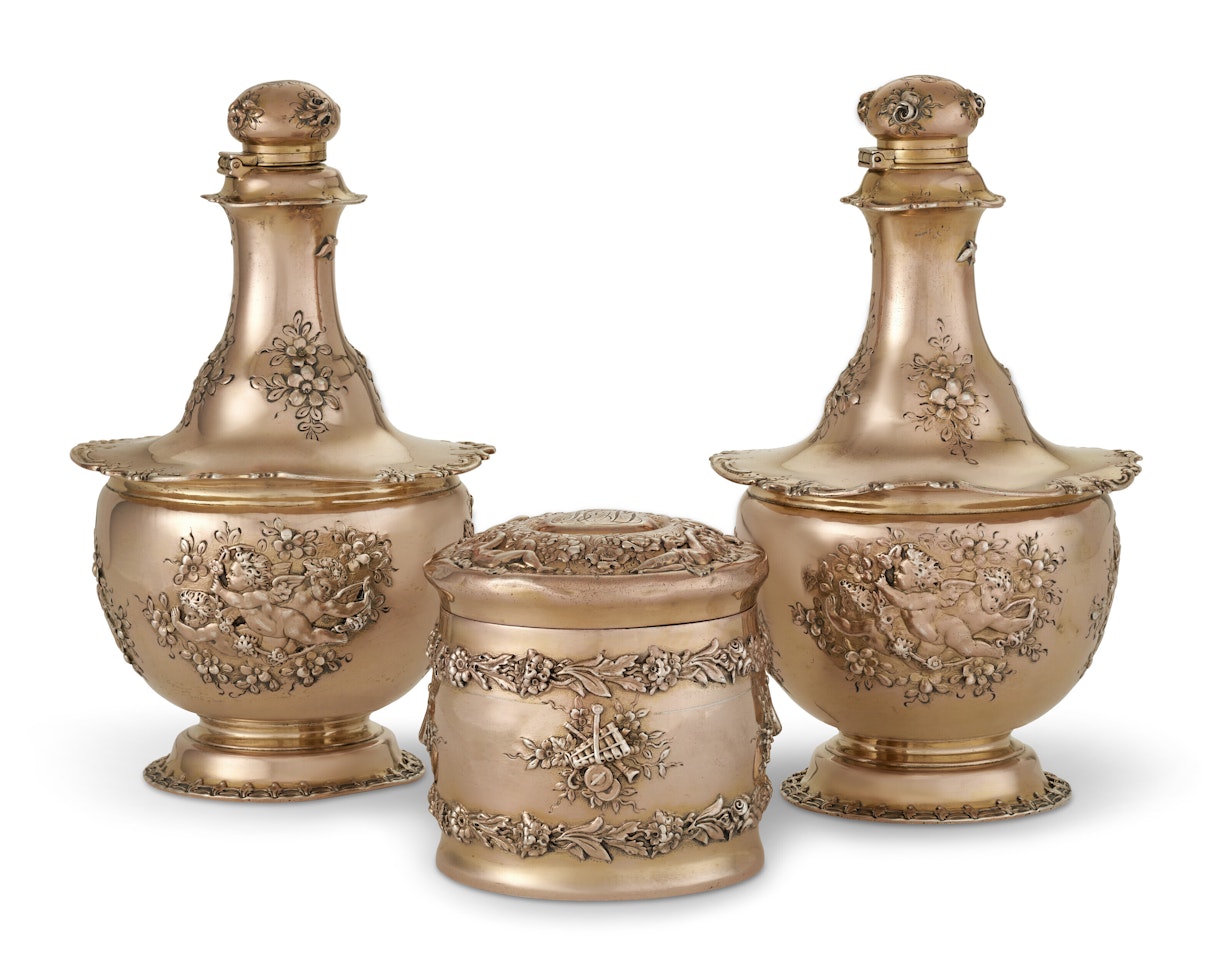 A PAIR OF AMERICAN SILVER-GILT PERFUME FLASKS AND MATCHING TOILET JAR by Tiffany & Co.