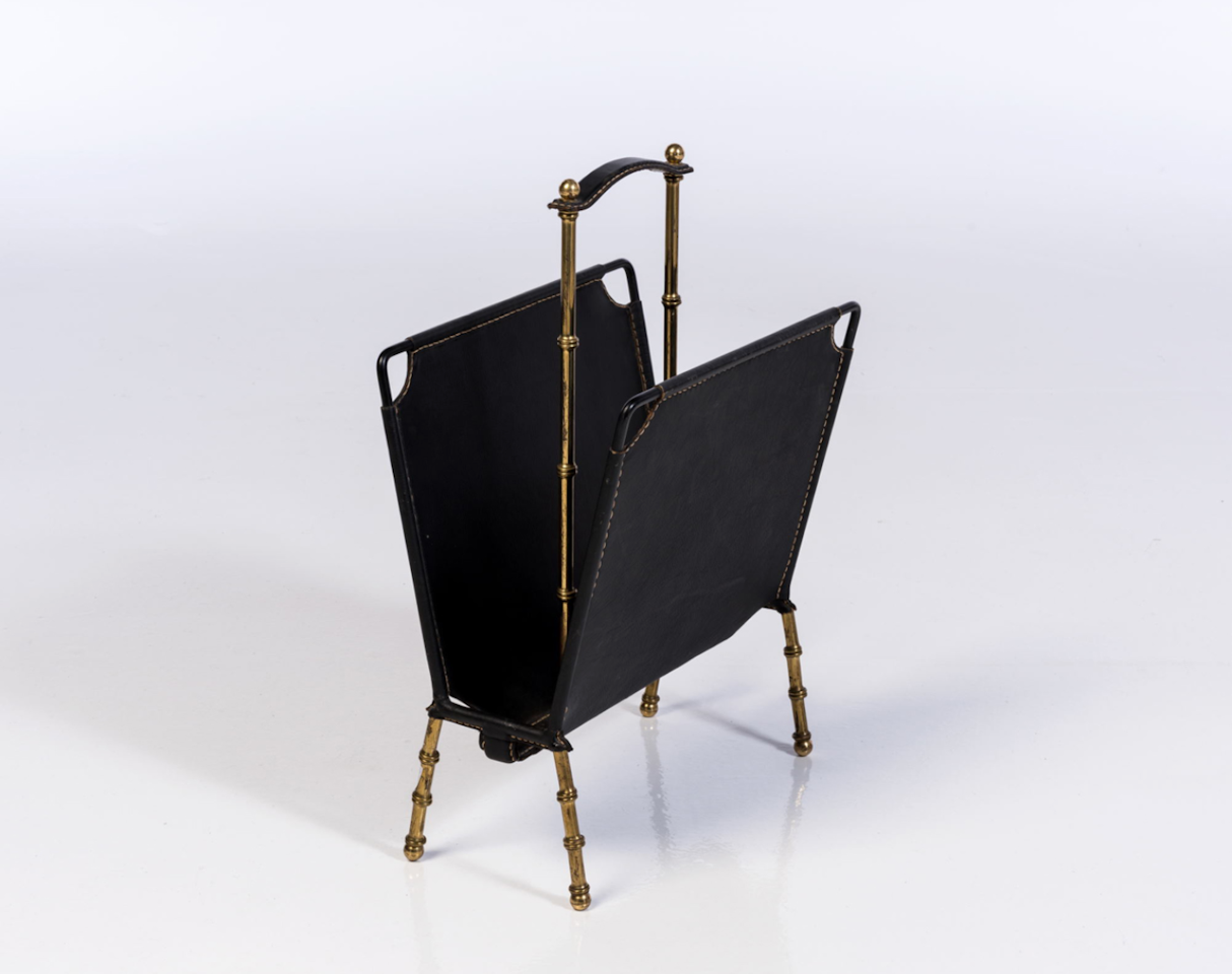 Magazine rack by Jacques Adnet