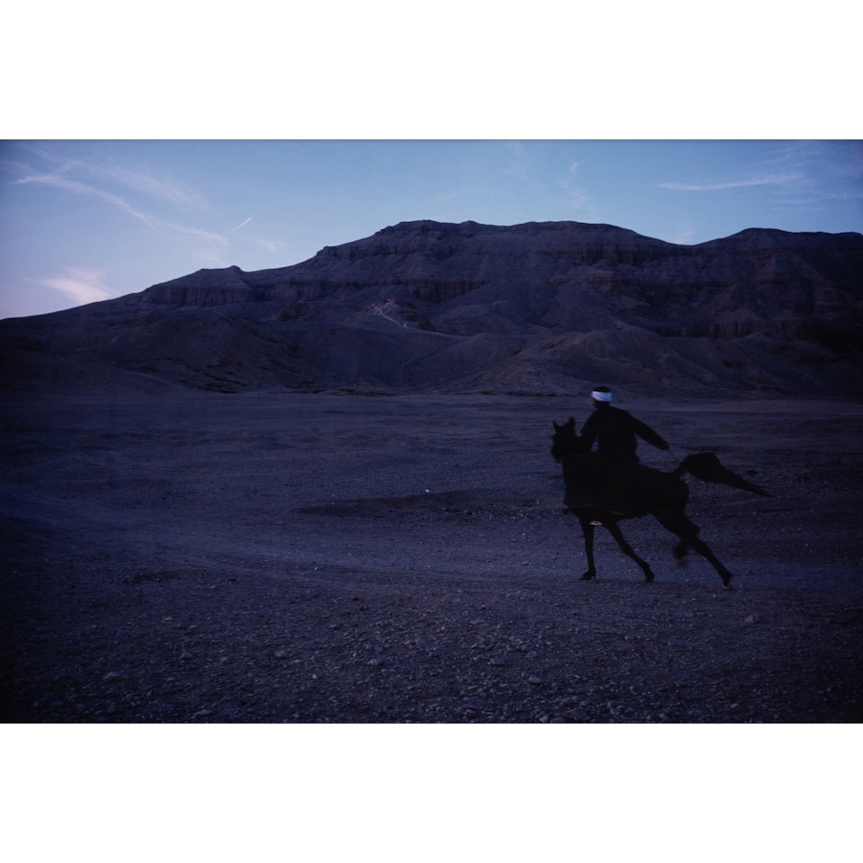 Jabalowe riding Roma into desert, Luxor by Nan Goldin