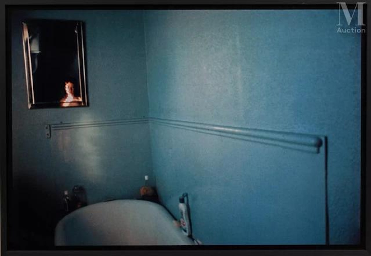 Self portrait in blue bathroom by Nan Goldin