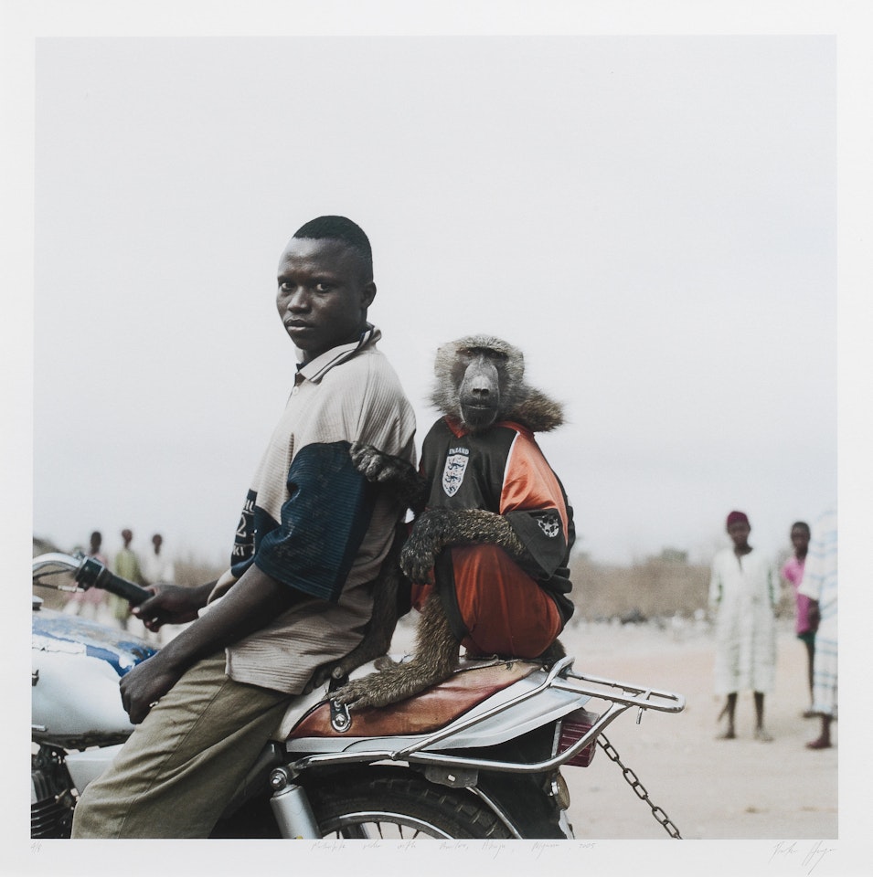 Motorbike rider with Amiloo, Abuja, Nigeria by Pieter Hugo