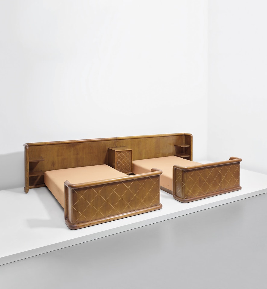 Two beds with integrated headboard and bedside table by Jean Royere