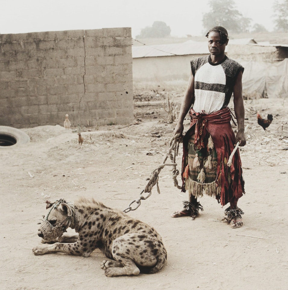 Mallam Mantari Lamal with Mainasara, Abuja, Nigeria by Pieter Hugo