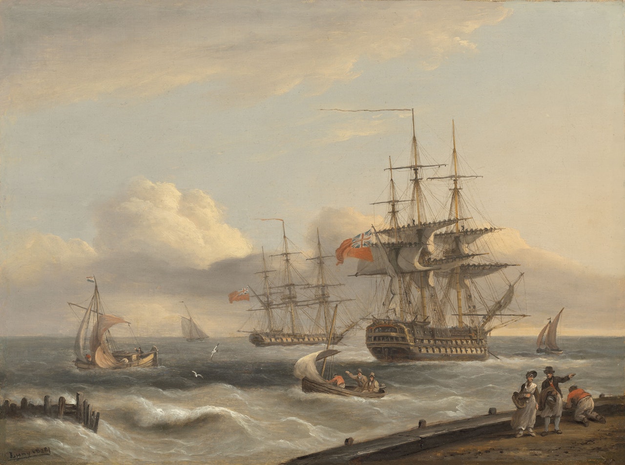 A British "74" unfurling its sails as it prepares to leave the anchorage with a frigate and various coastal craft beyond by Thomas Luny
