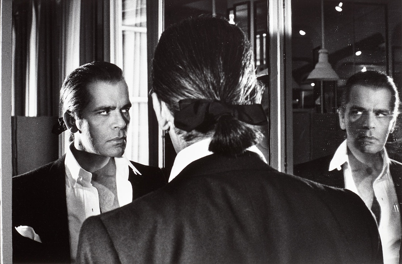 Karl Lagerfeld at Chanel and Mirrors, Paris by Helmut Newton