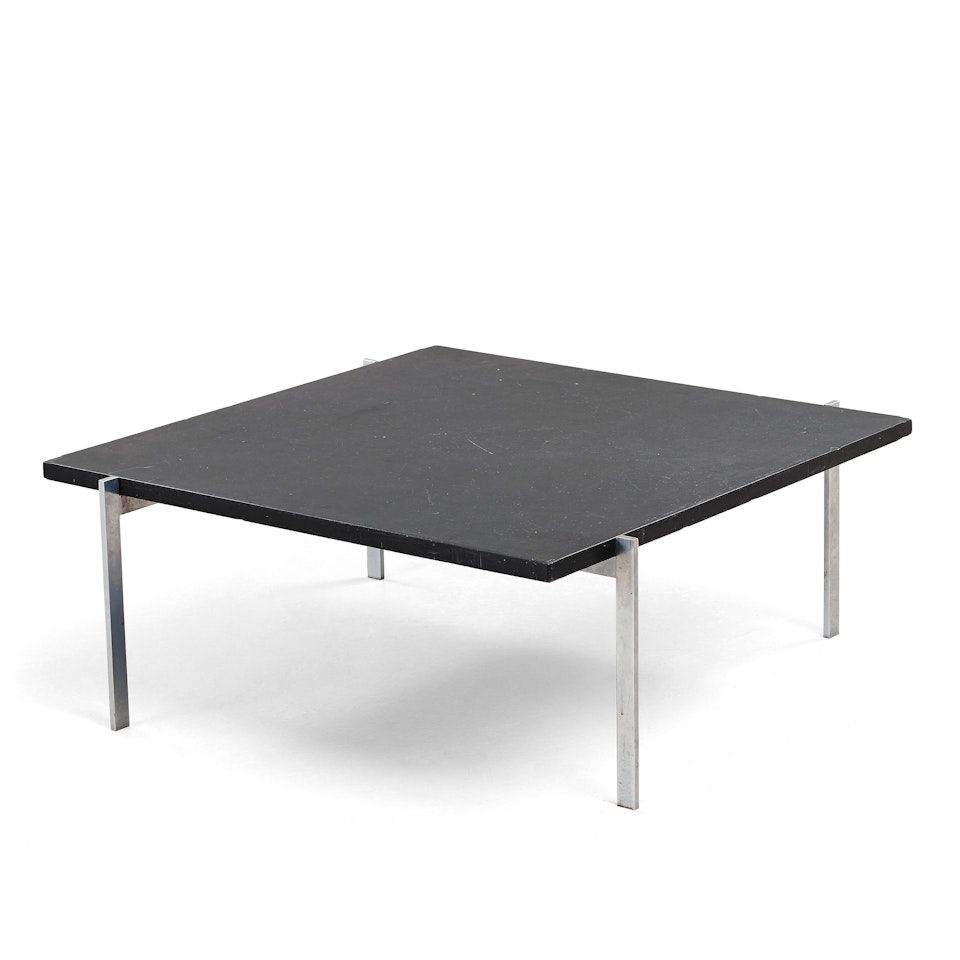 a "PK-61" steel and black stone top table by Poul Kjaerholm