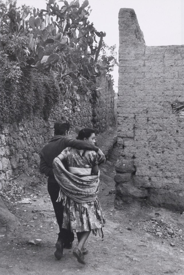 Untitled (Couple Walking) by Henri Cartier-Bresson