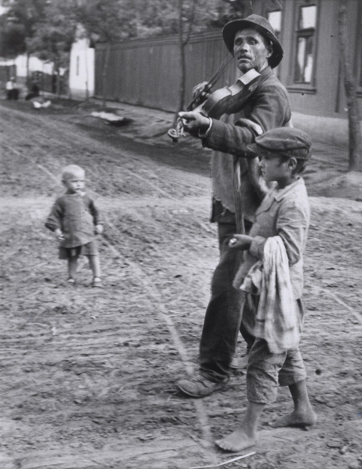 Wandering Violinist, Abony, 19 July , 1921 by André Kertész