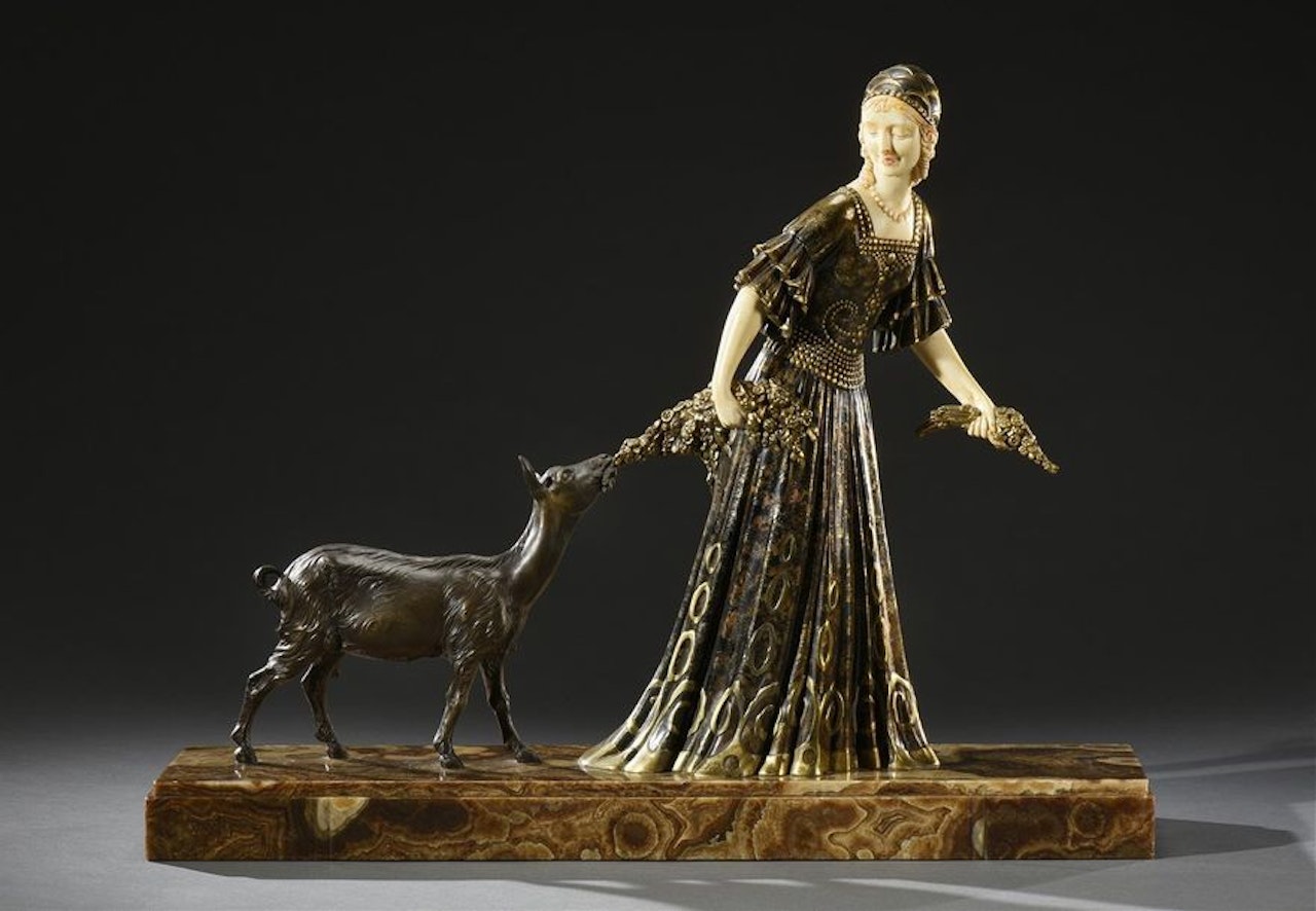 Elegant with a kid by Demetre Chiparus
