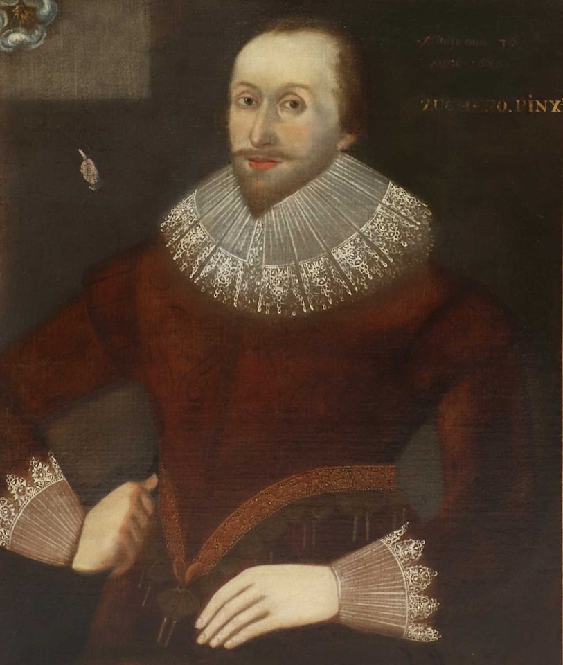 Portrait of a gentleman, standing three-quarter-length, in a red doublet with lace collar and cuffs by English School
