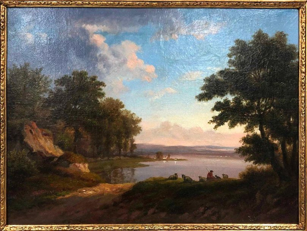 Shepherd and his flock by a lake by French School
