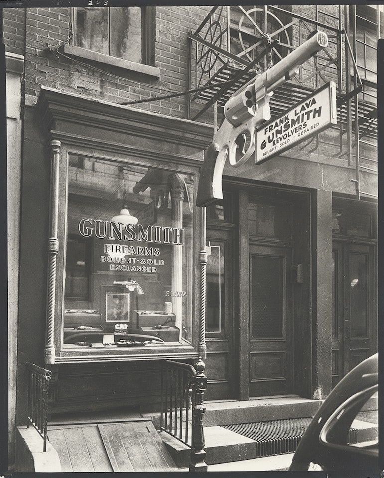 Gunsmith - 6 Central Market Place, Manhattan by Berenice Abbott