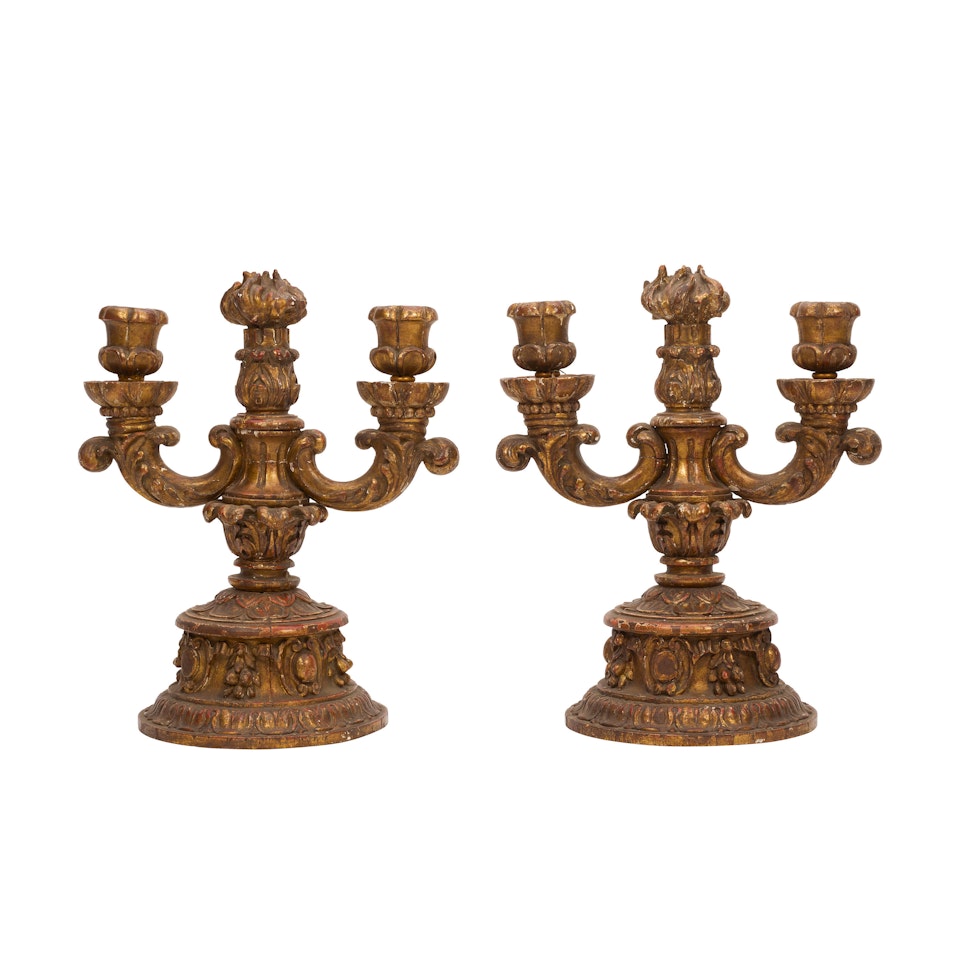 A PAIR OF BAROQUE STYLE CARVED PARCEL GILT AND PAINTED TWO-LIGHT CANDELABRA by Unknown (Baroque style)
