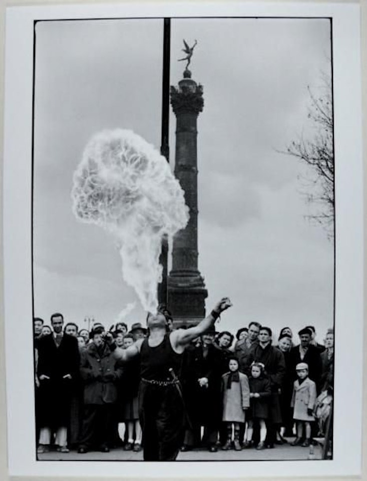 Fire Eater, Place de la Bastille by Henri Cartier-Bresson